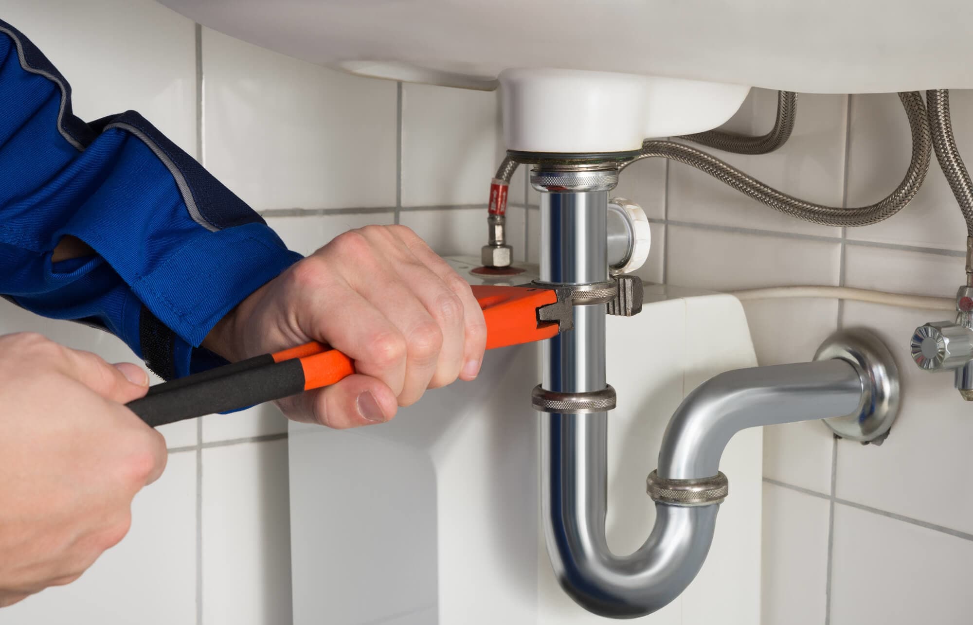 Professional plumbing and heating repair services in Kensington MD - skilled technician working on pipe installation and maintenance